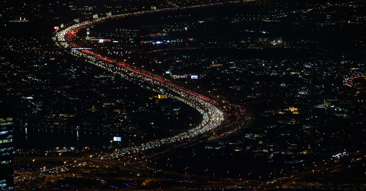 **SUBJECT:** A congested highway at night.