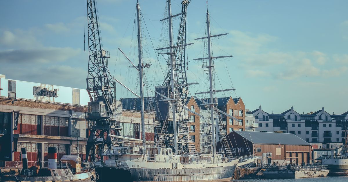 A serene view of historic ships moored in Bristol Harbor, showcasing maritime heritage.