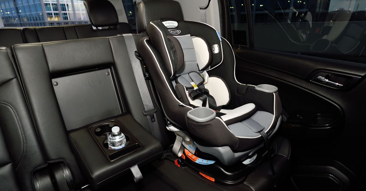 A fitted child car seat in the rear of a people carrier