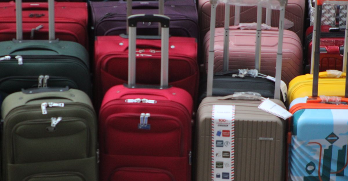 Multiple suitcases of different sizes lined up together